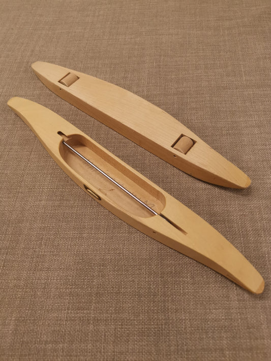 Vävskyttel med hjul